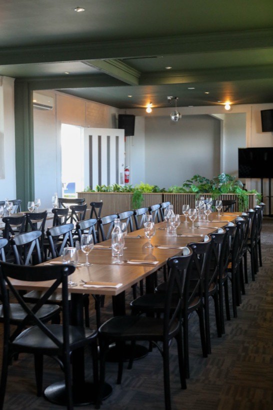 Tables set with places and greenery