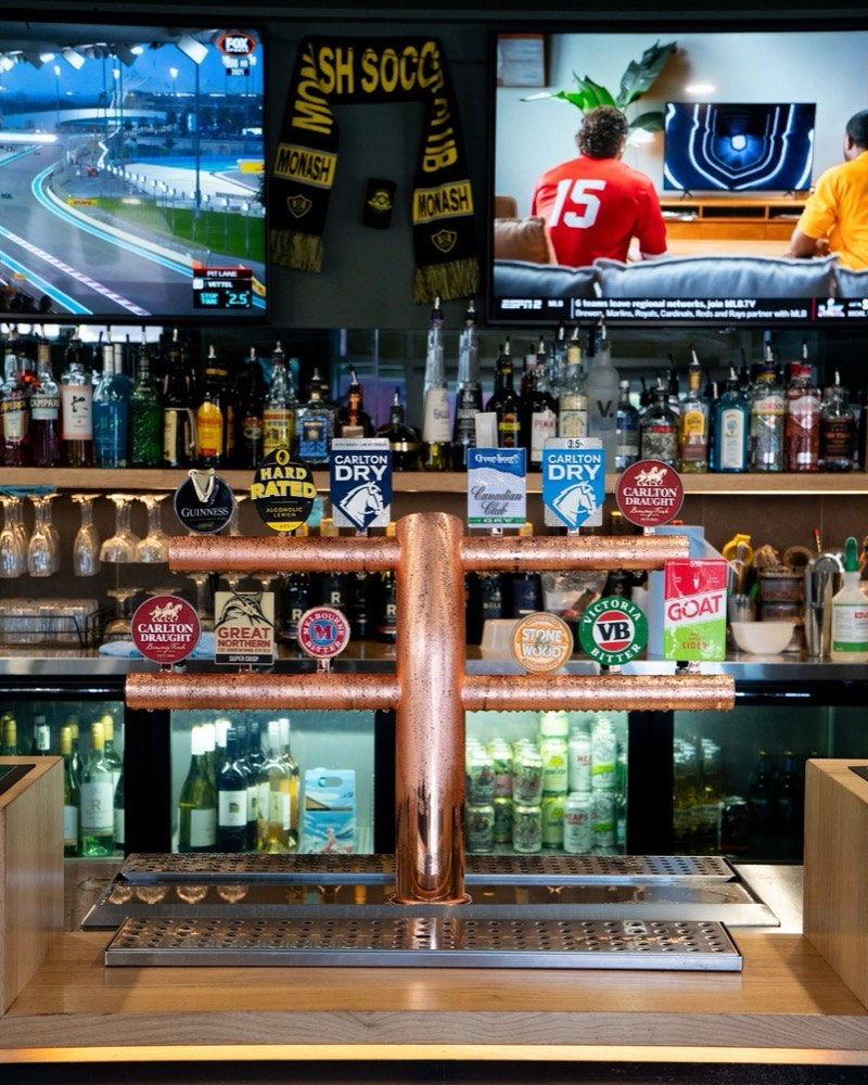 The copper tap tower behind the bar